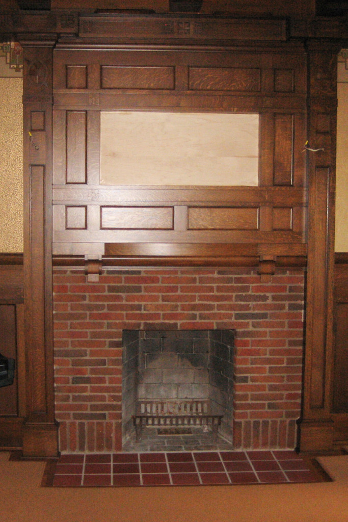 Step 7 The new wood is stained medium brown to match the old, and the fireplace is just awaiting new sconces and the restored frieze.