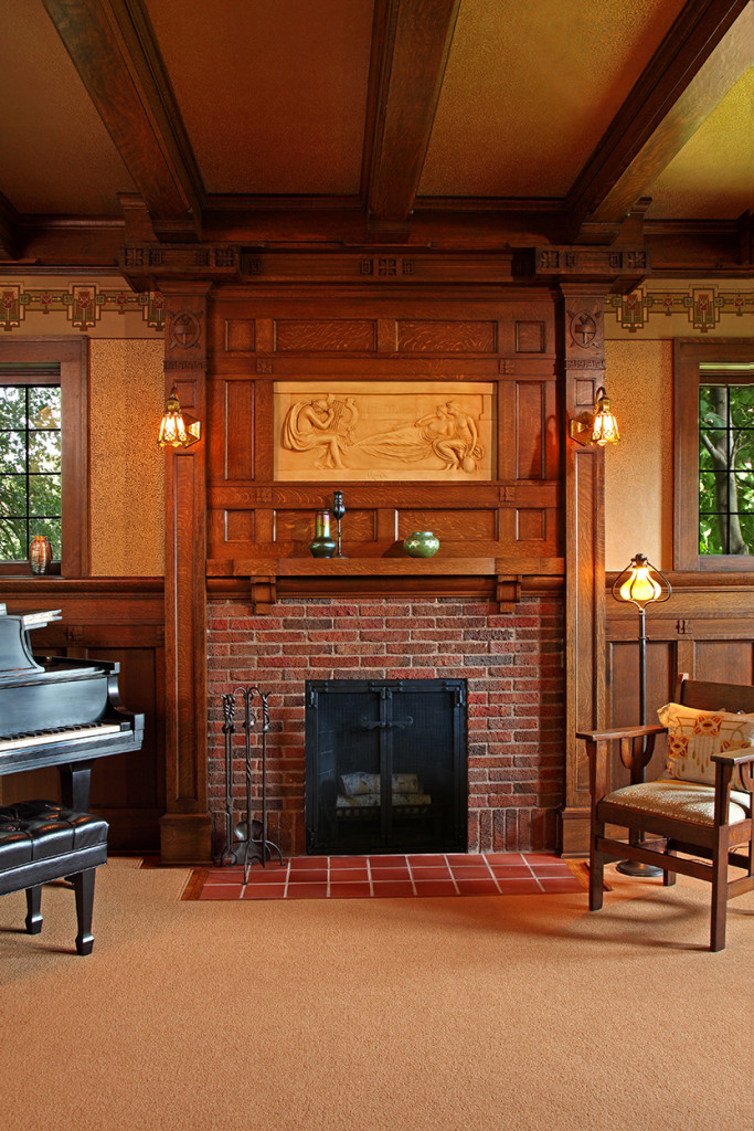 Entire restored fireplace. Also the coffered panelling, gold & ivory botannical wallpaper with intricate border, multi-paned windows, and dull gold and beamed ceiling. A warm Arts & Crafts symphony of color, pattern, shape, and natural materials.